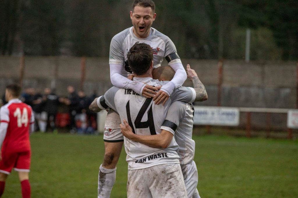 Aiden Lewis celebrates with Luke Gullick and Gavin Beddard