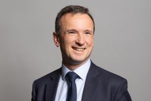 1920px-Official_portrait_of_Rt_Hon_Alun_Cairns_MP_crop_1