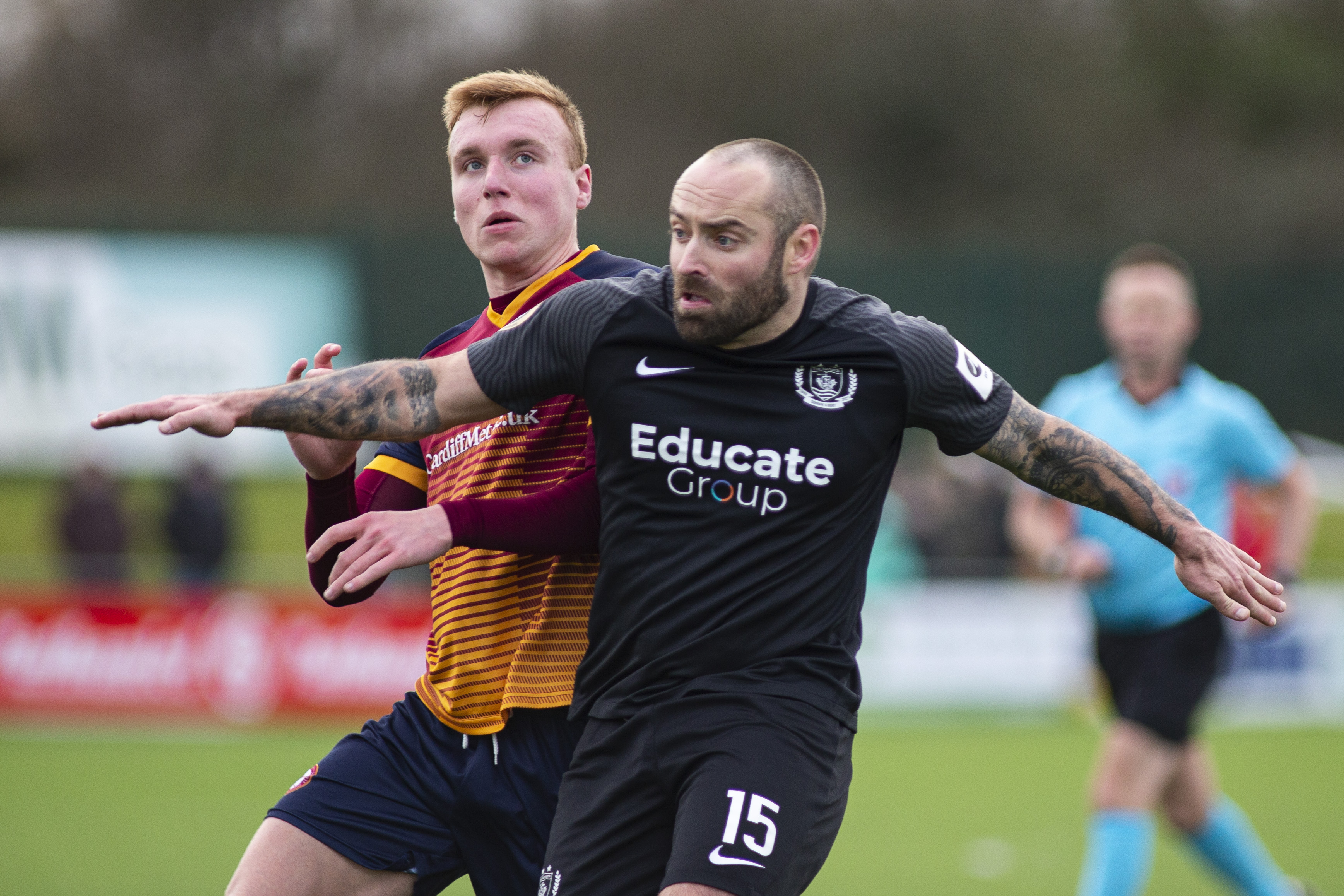 Danny Holmes of Connahs Quay in action against Lewis Rees of Cardiff Met. Cardiff Metropolitan University v Connahs Quay in the Nathaniel MG Cup Final at Bryntirion Park on the 6th February 2022