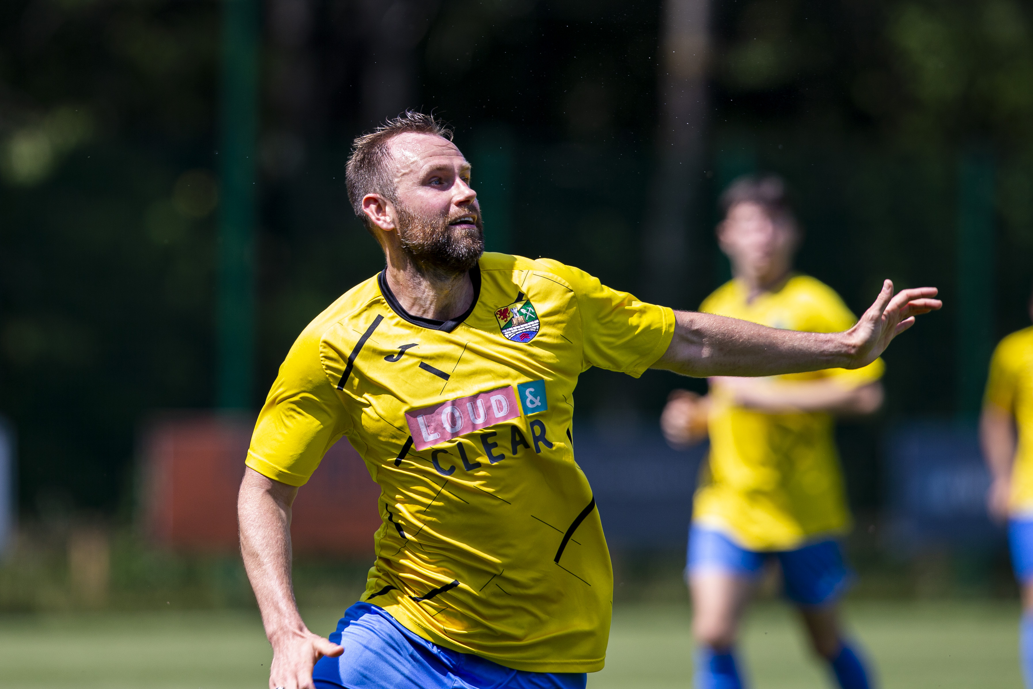 Llanrumney United player Sam O'Sullivan looks up in the air.