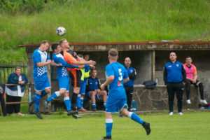 Blaenrhondda and Ynyshir players compete for the ball