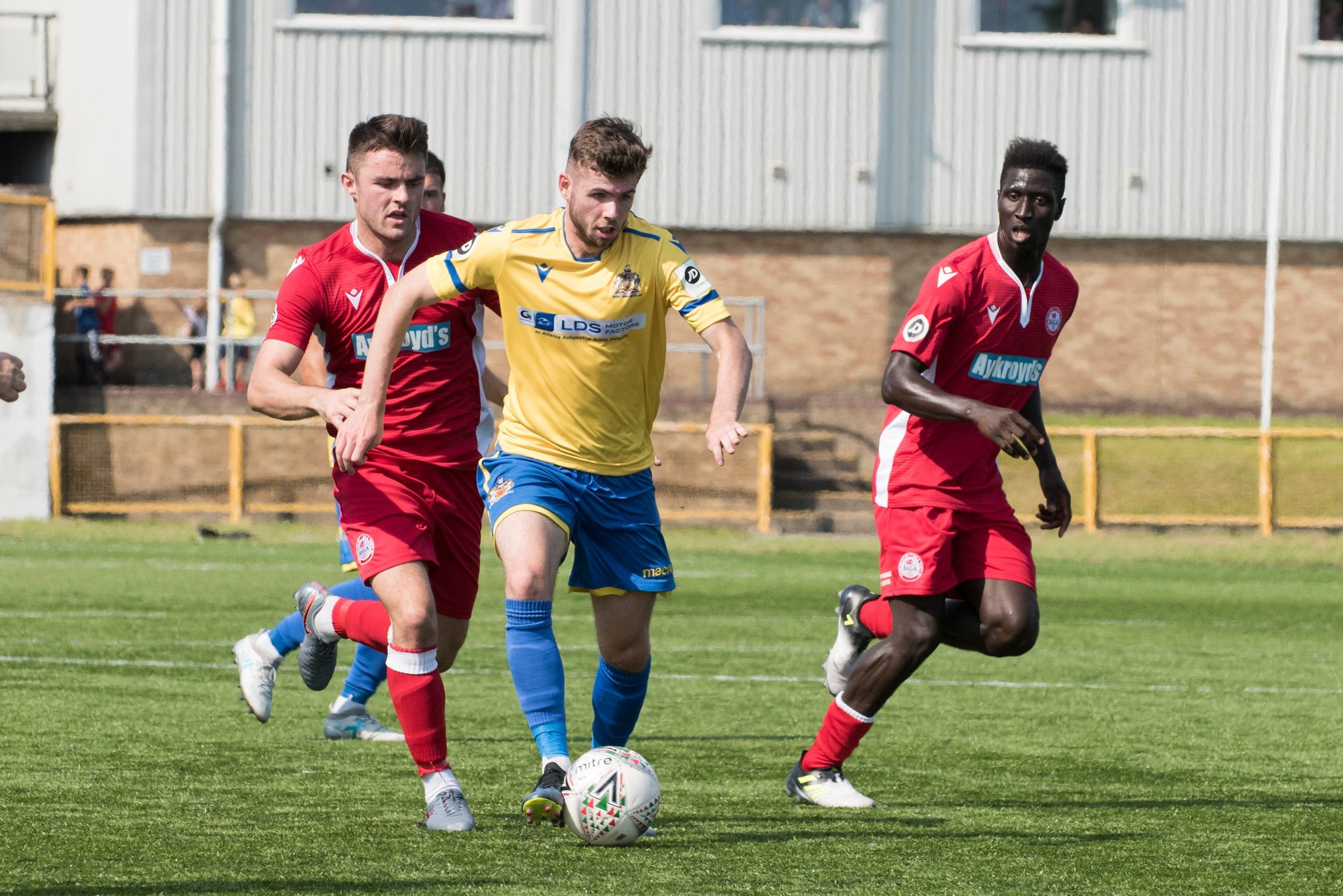 Tom Fry on the ball for Barry Town United against Bala Town