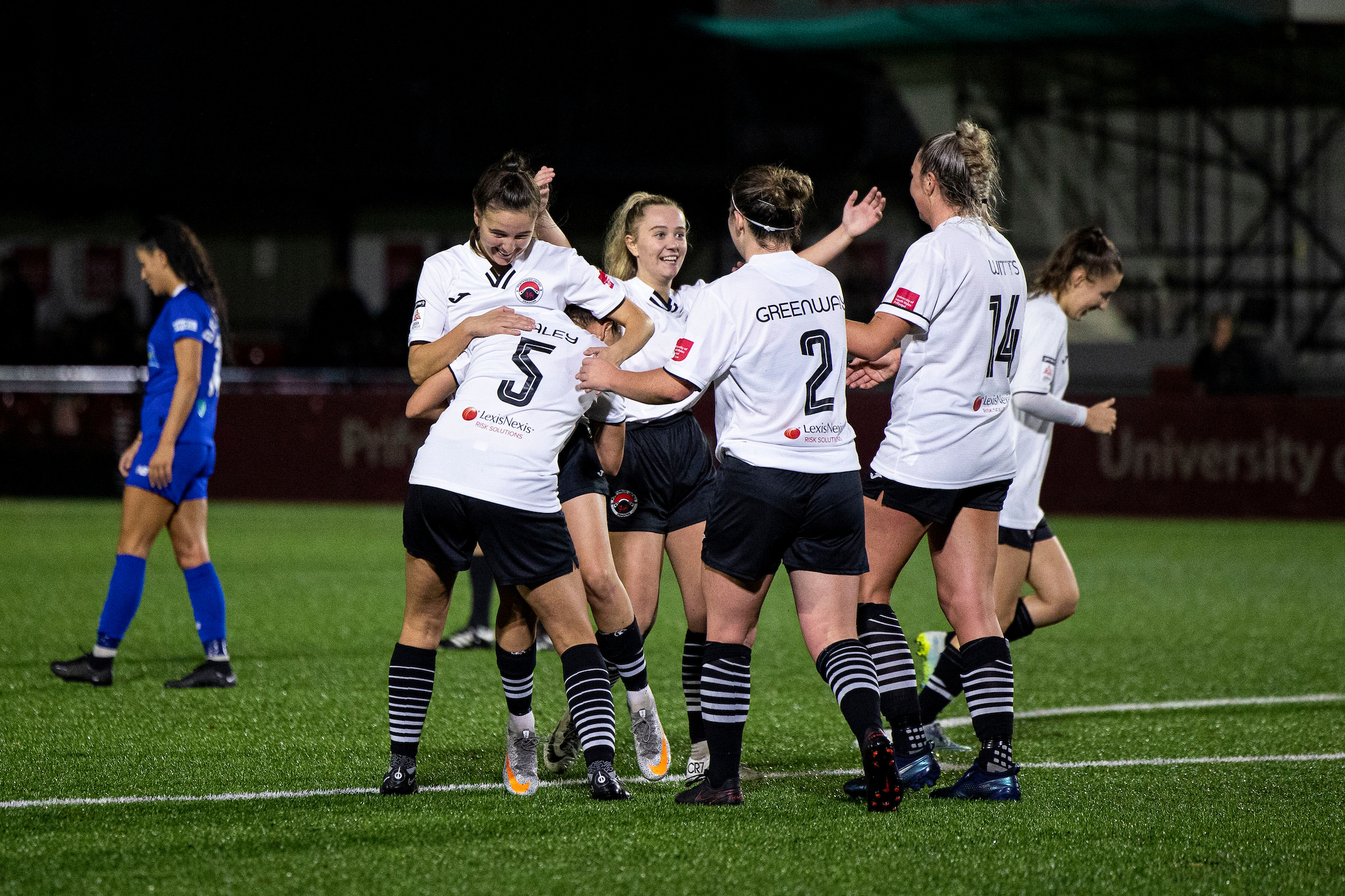 Pontypridd United players celebrate scoring against Cardiff City at the USW Sport Park.