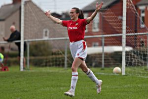 Rosie Hughes celebrates scoring a goal for Wrexham against Llanfair United.