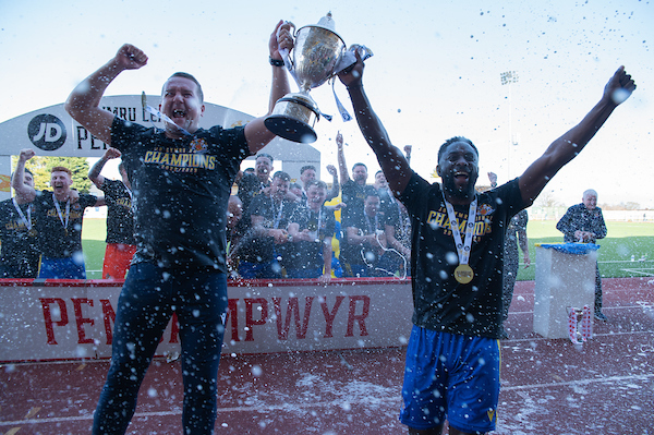 Lee Kendall and Kayne McLaggon lift the Cymru South trophy