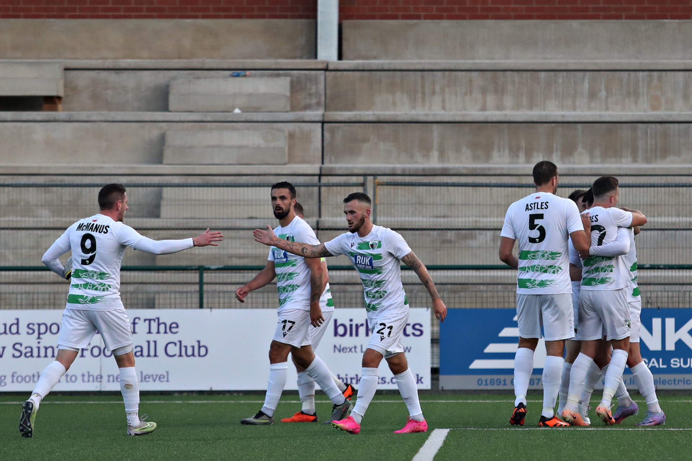 TNS players celebrate Rory Holden's goal against Swift Hesper.