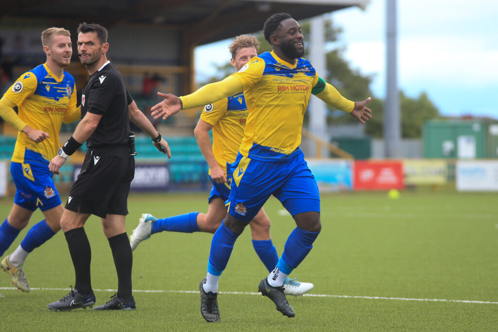 Kayne McLaggon wheels away in celebration after putting Barry Town in front.