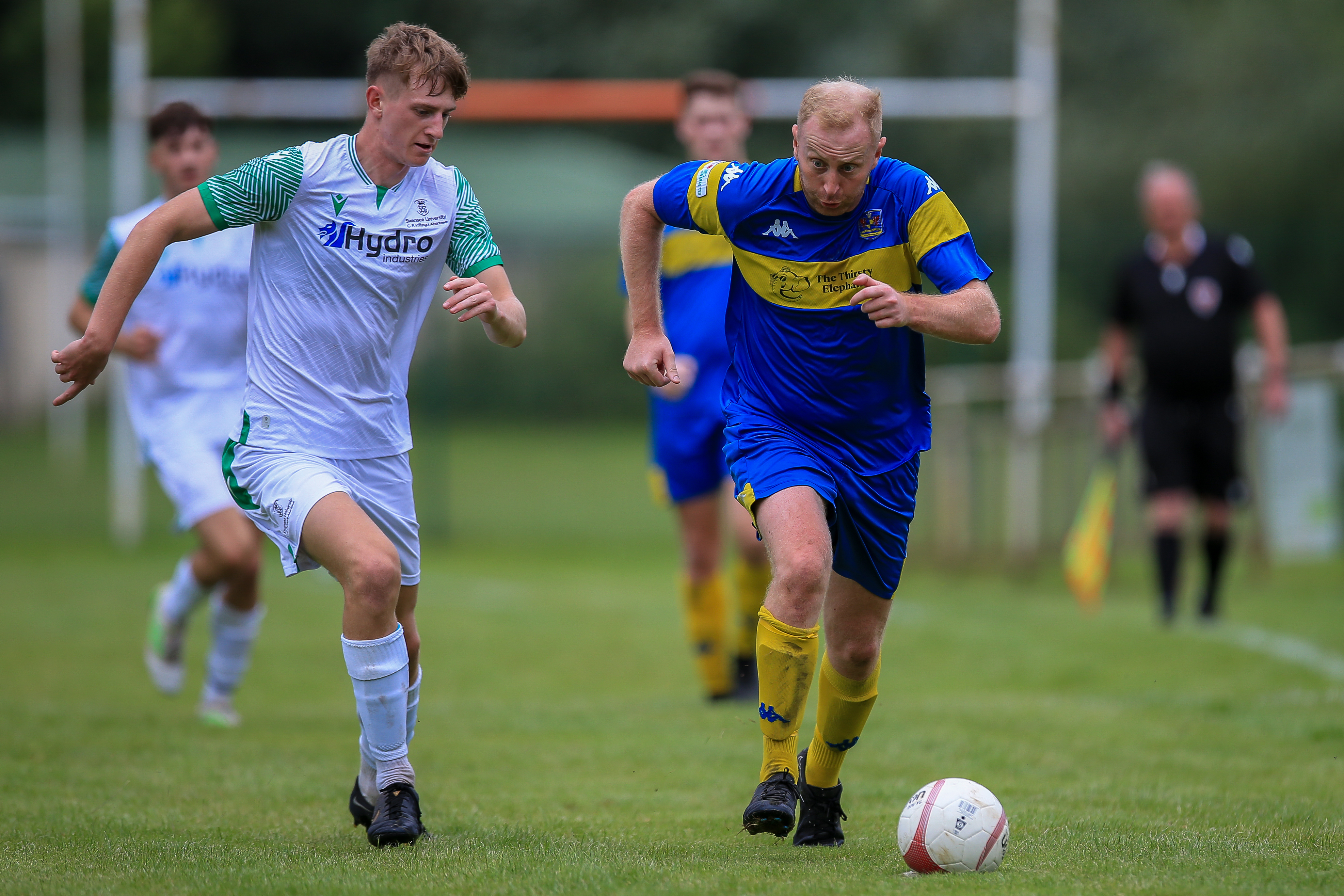 A Swansea University and Pontyclun player battle for possession.