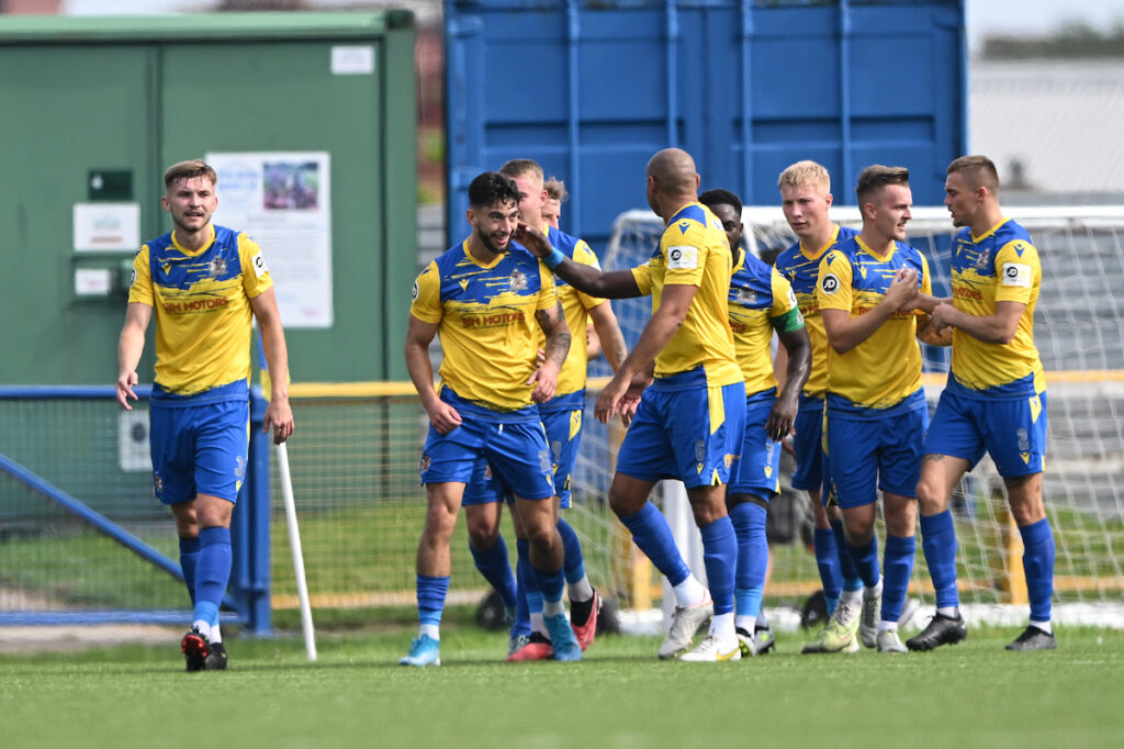 Barry Town players celebrate Ollie Hulbert's goal. 
