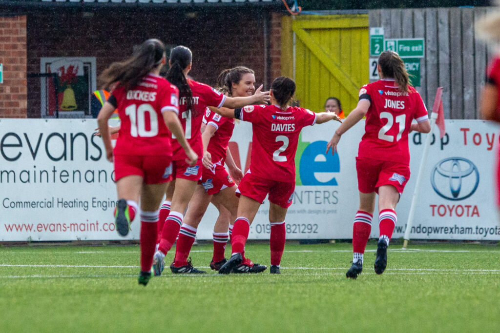 Wrexham Women's players celebrate Rebecca Pritchard's goal against Swansea City.