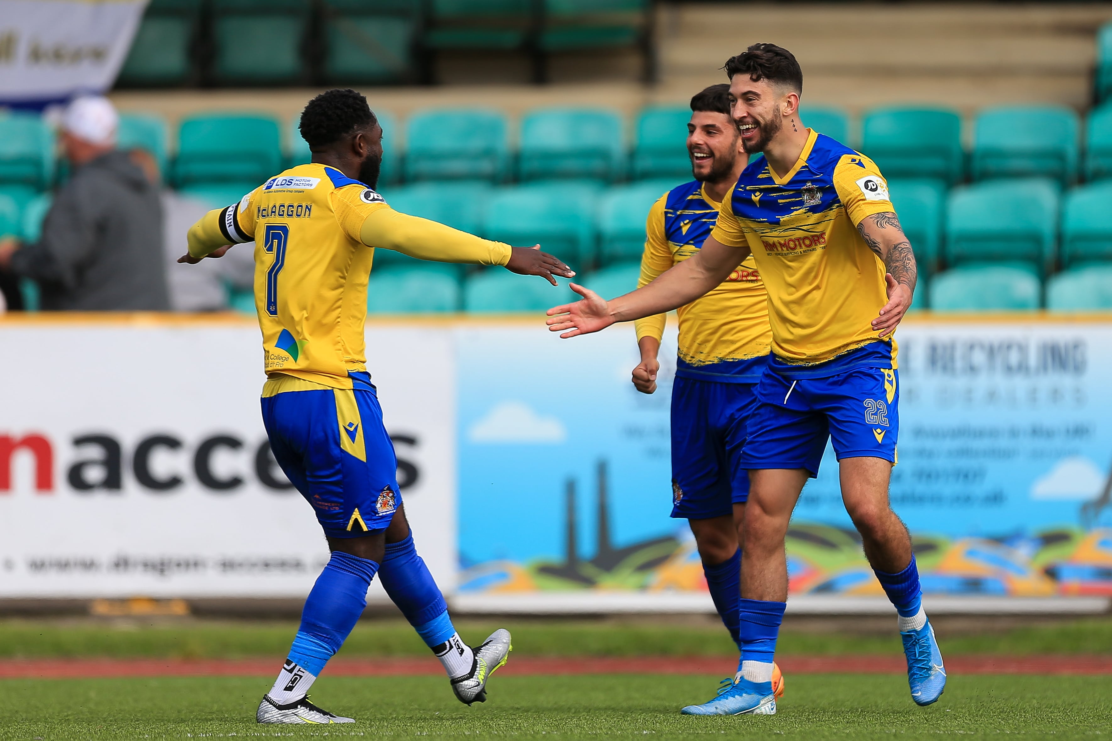 Barry Town striker Ollie Hulbert celebrates with Kayne McLaggon.