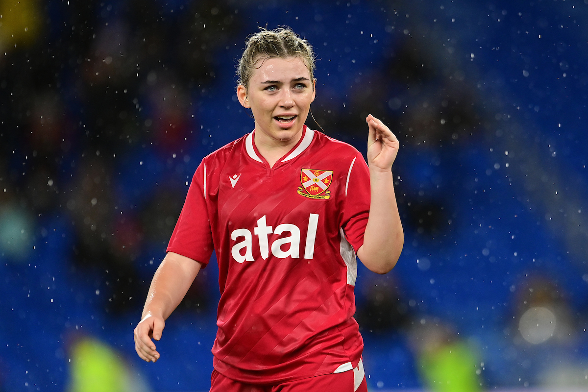 Abergavenny Women's midfielder Kate Wiliams gestures to a teammate