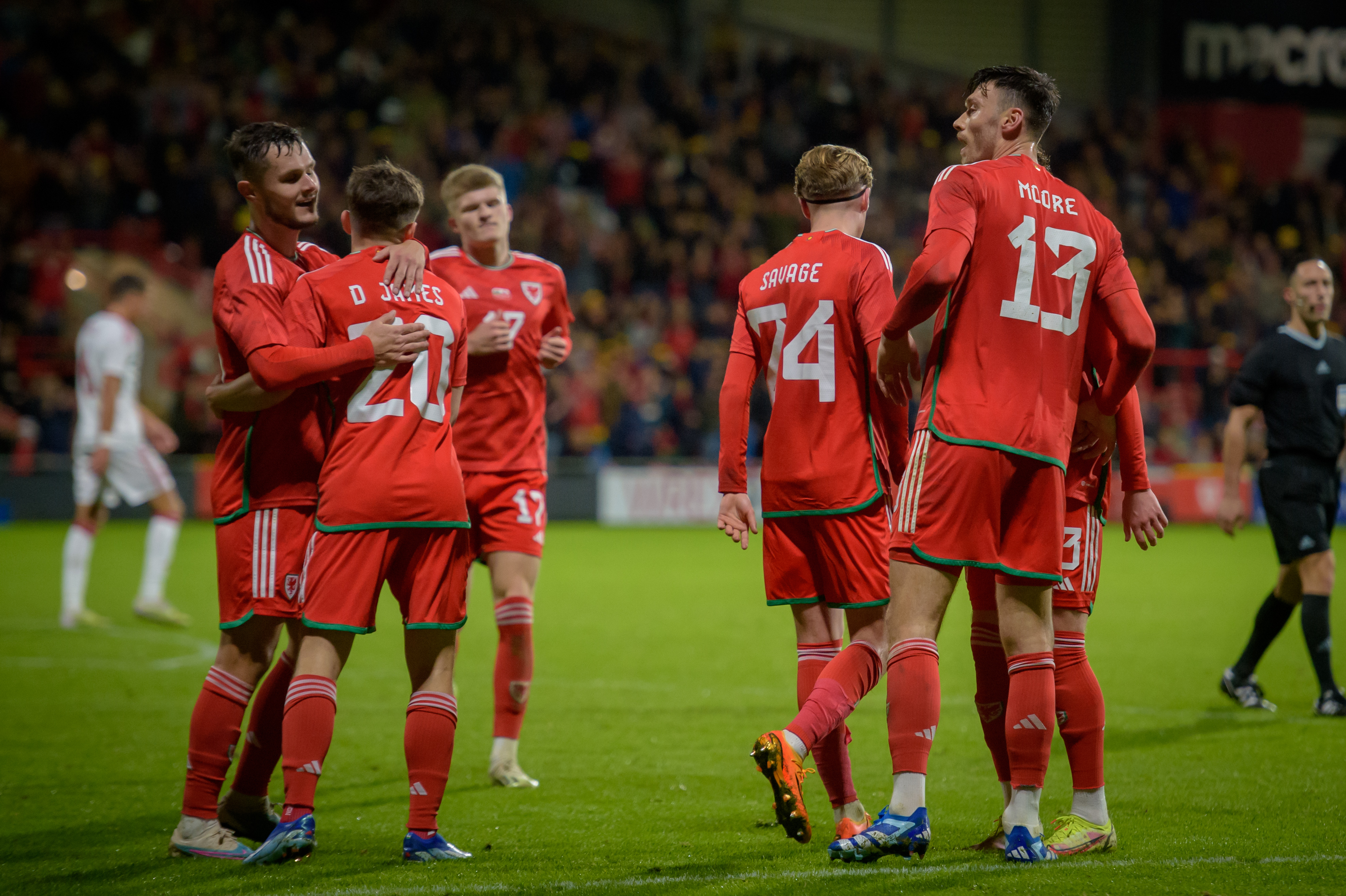 Wales players celebrate against Gibraltar after scoring a goal