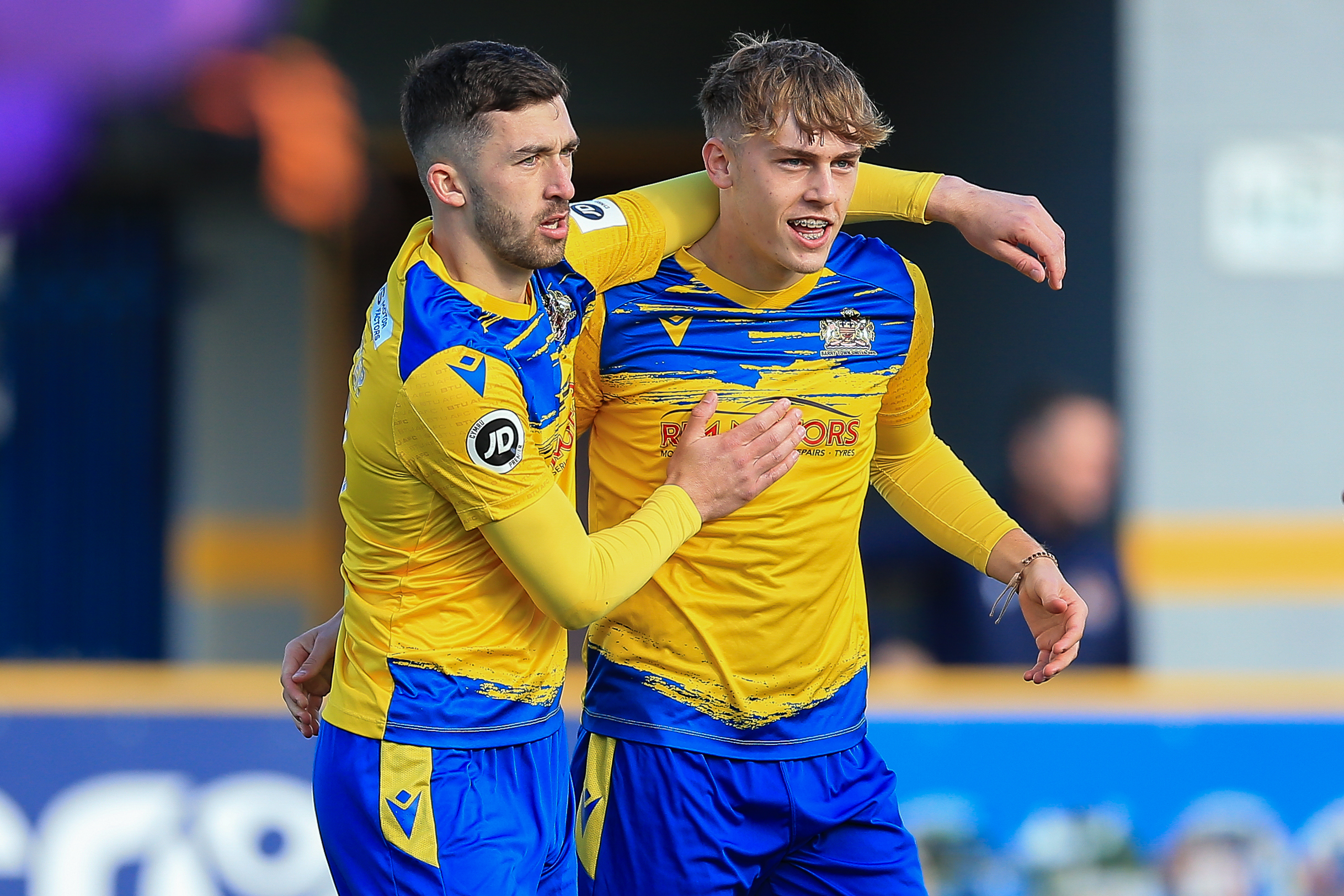 Callum Huggins celebrates scoring a goal for Barry Town against Porthcawl Town