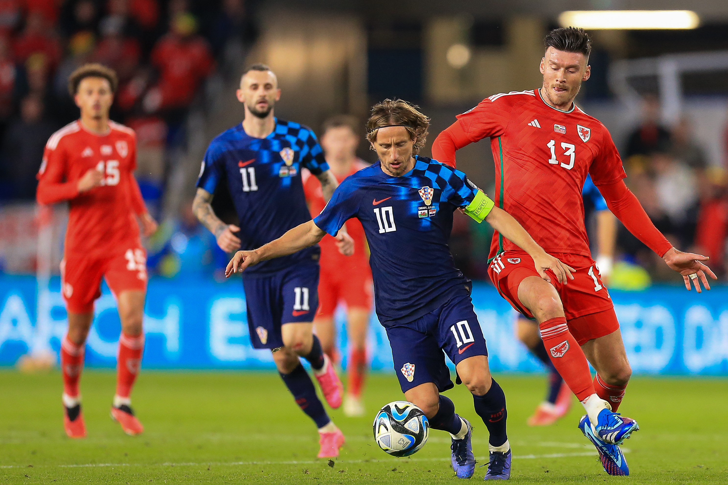 Wales striker Kieffer Moore battles with Croatia's Luka Modric.