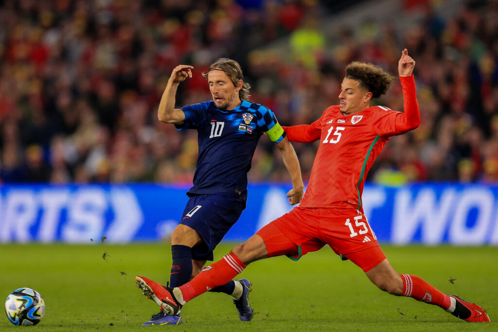 Wales midfielder Ethan Ampadu tackles Croatia's Luka Modric. 