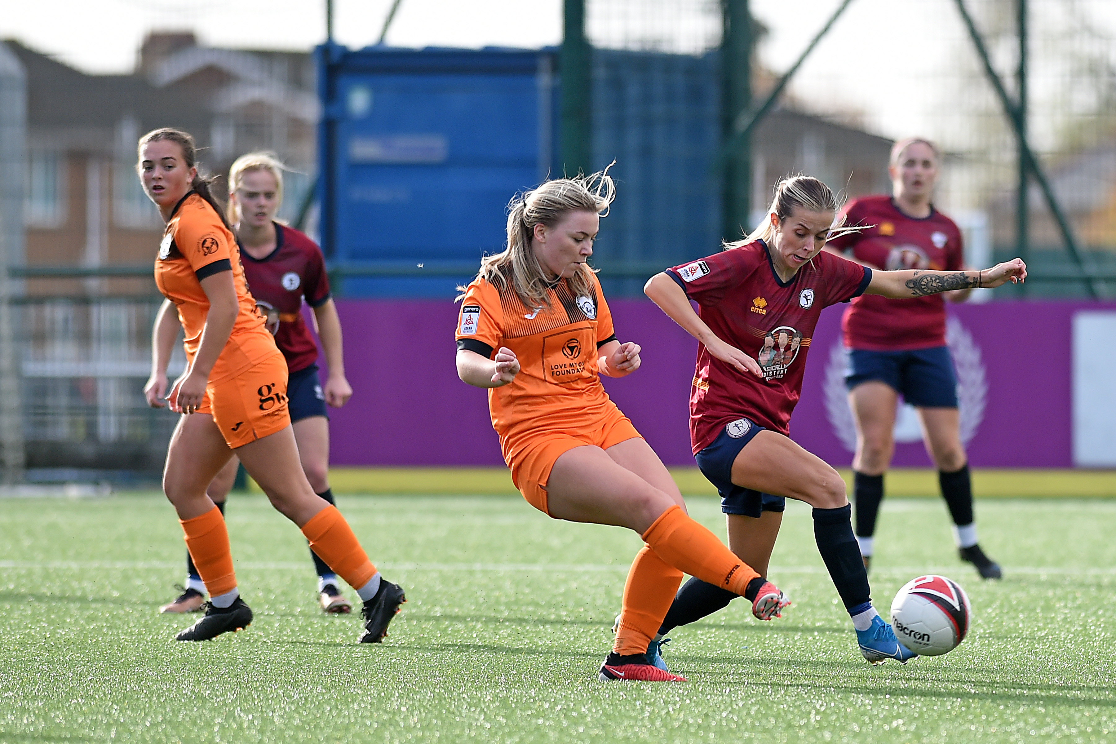 Cardiff Met and Pontypridd United battle for the ball.