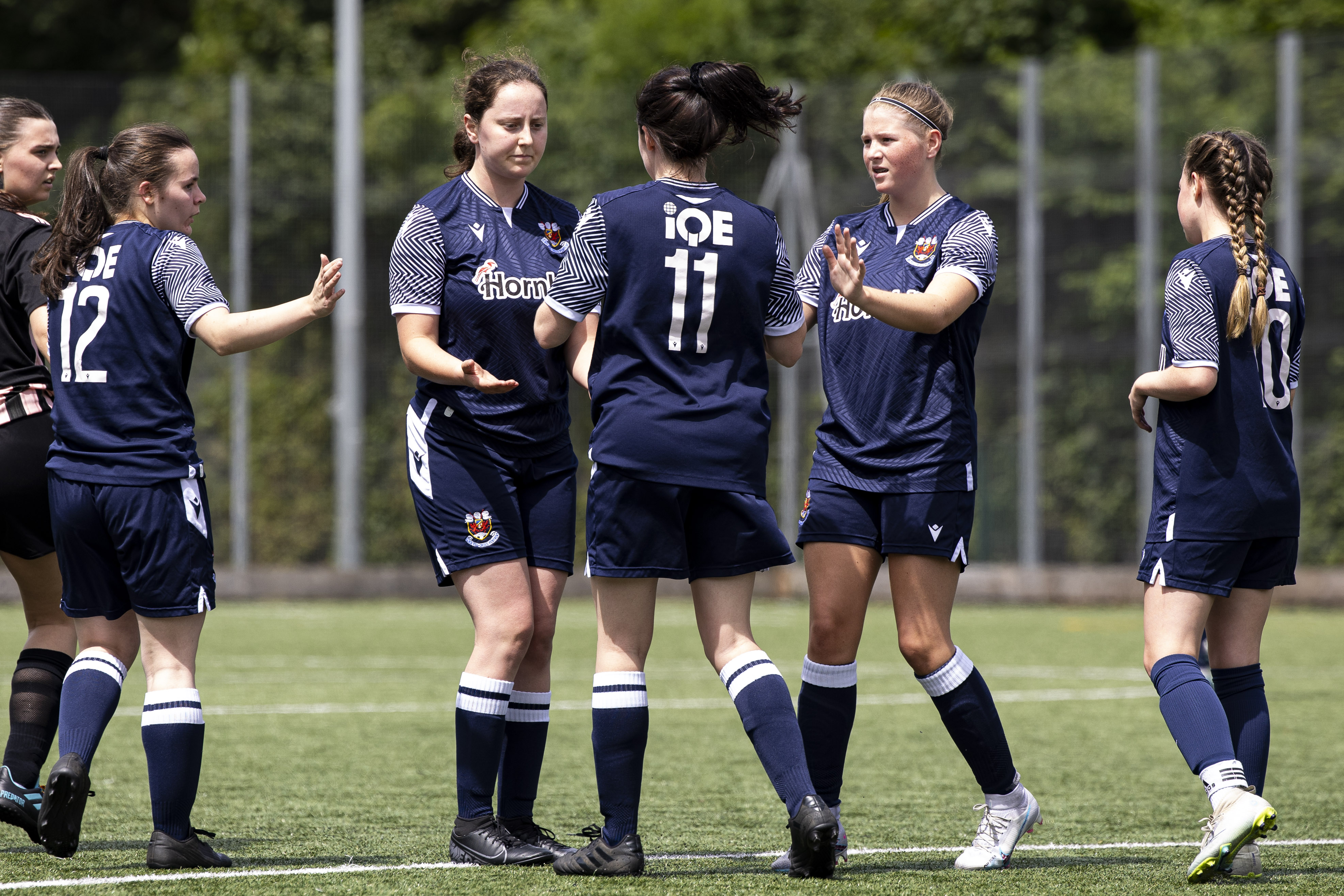 Penybont Women players celebrate a goal against Pontypridd Ladies