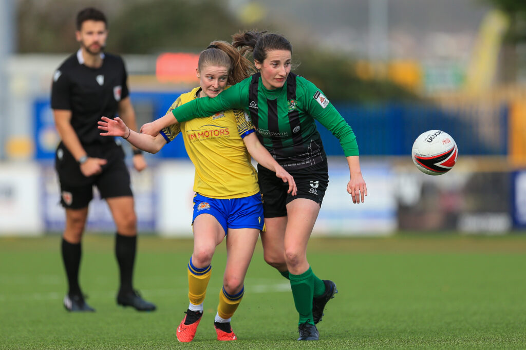 Barry Town and Aberystwyth Town players compete for the ball. 