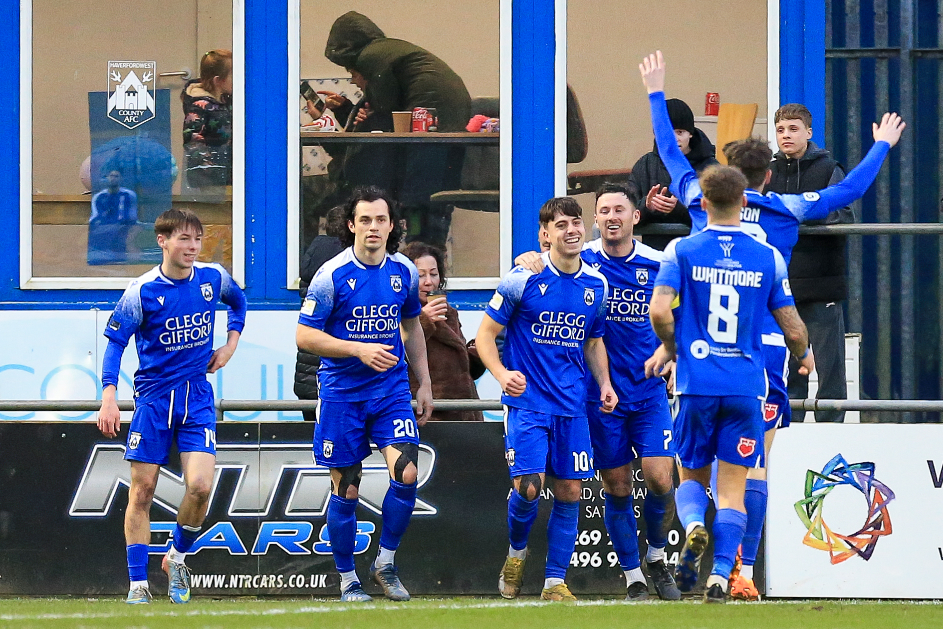 Haverfordwest County players celebrate a goal against Barry Town