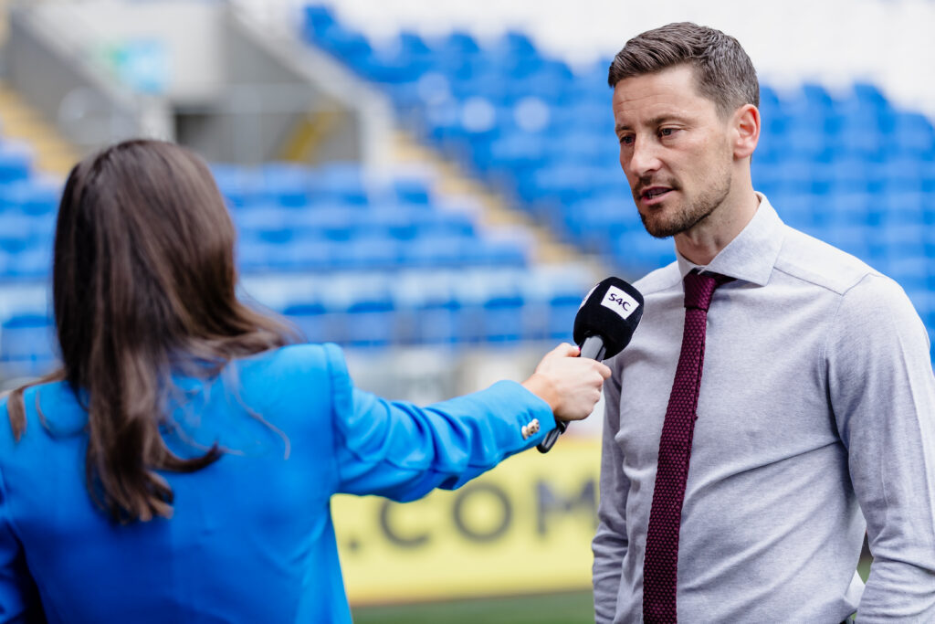 Anthony Limbrick is interviewed by Sgorio presenter Sioned Dafydd.