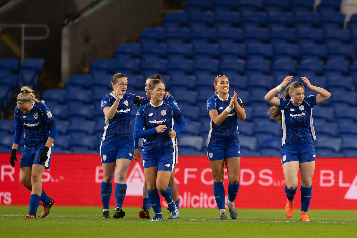 Eliza Collie celebrates with her Cardiff City teammates after scoring against Wrexham.