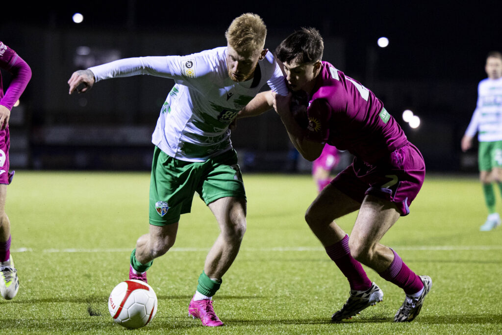 Brad Young of TNS in action against Kian Jenkins of Swansea City.
The New Saints v Swansea City u21in the Nathaniel MG Cup Final at Jenner Park on the 20th January 2024.