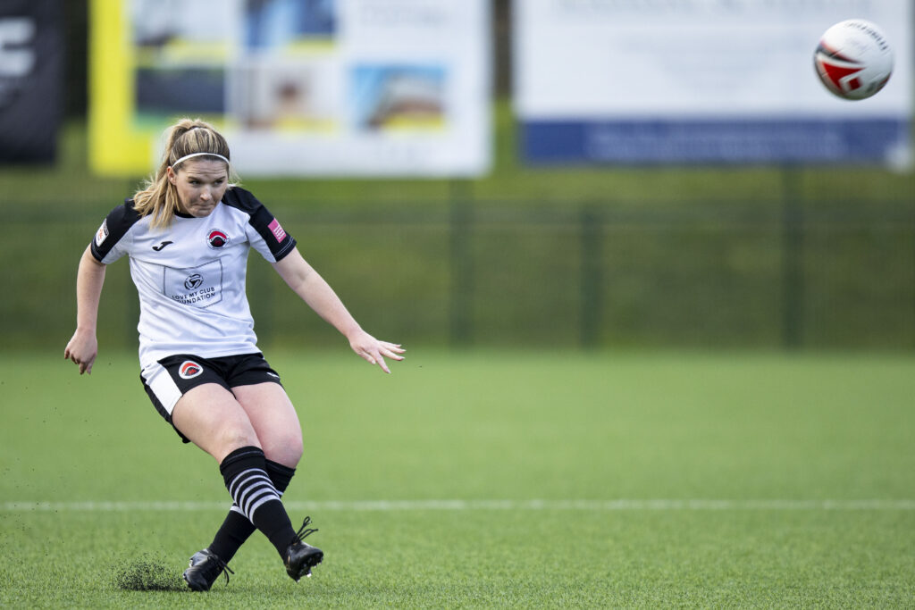 Shannon Hindmash of Pontypridd United takes a free kick in an Adran Premier game