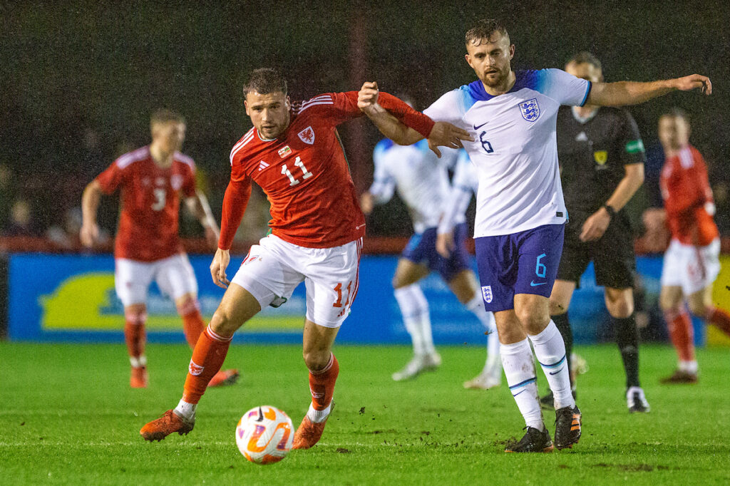 Wales C midfielder Clayton Green in possession of the ball against England C