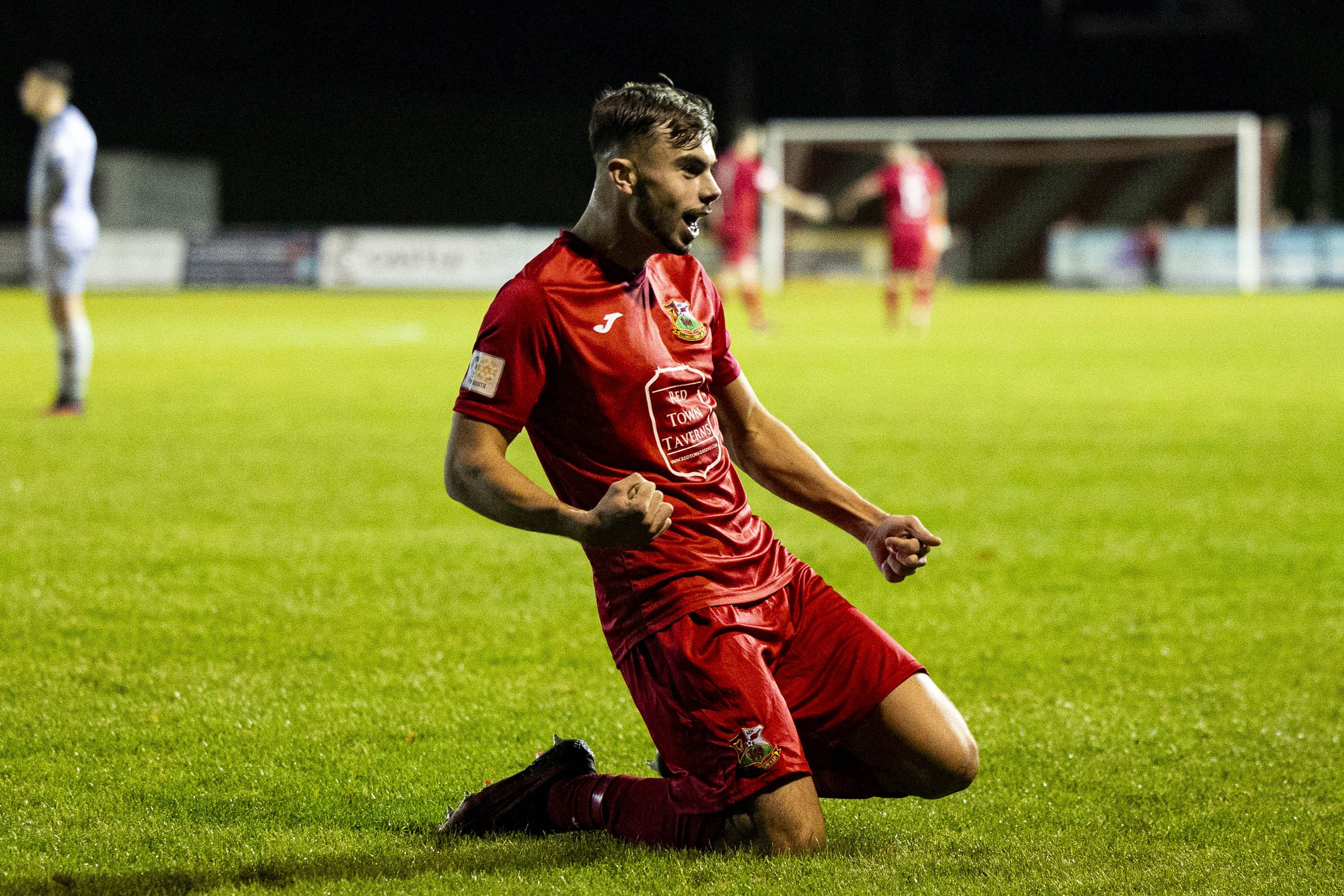 Ethan Cann celebrates scoring a goal for Llanelli Town against Abertillery Bluebirds in the Cymru South, Wales second tier