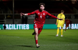 Lewis Koumas celebates scoring for Wales against Lithuania