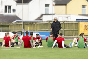 Wales C manager Mark Jones undertakes a training session at Carrmarthen Town's Richmond Park