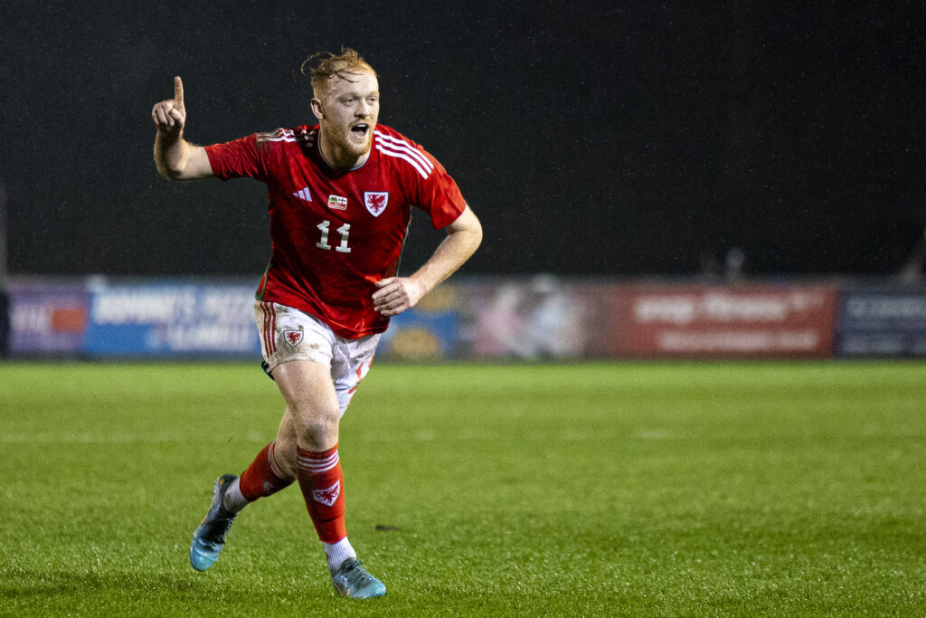 Sion Bradley celebrates after scoring for Wales C against England C