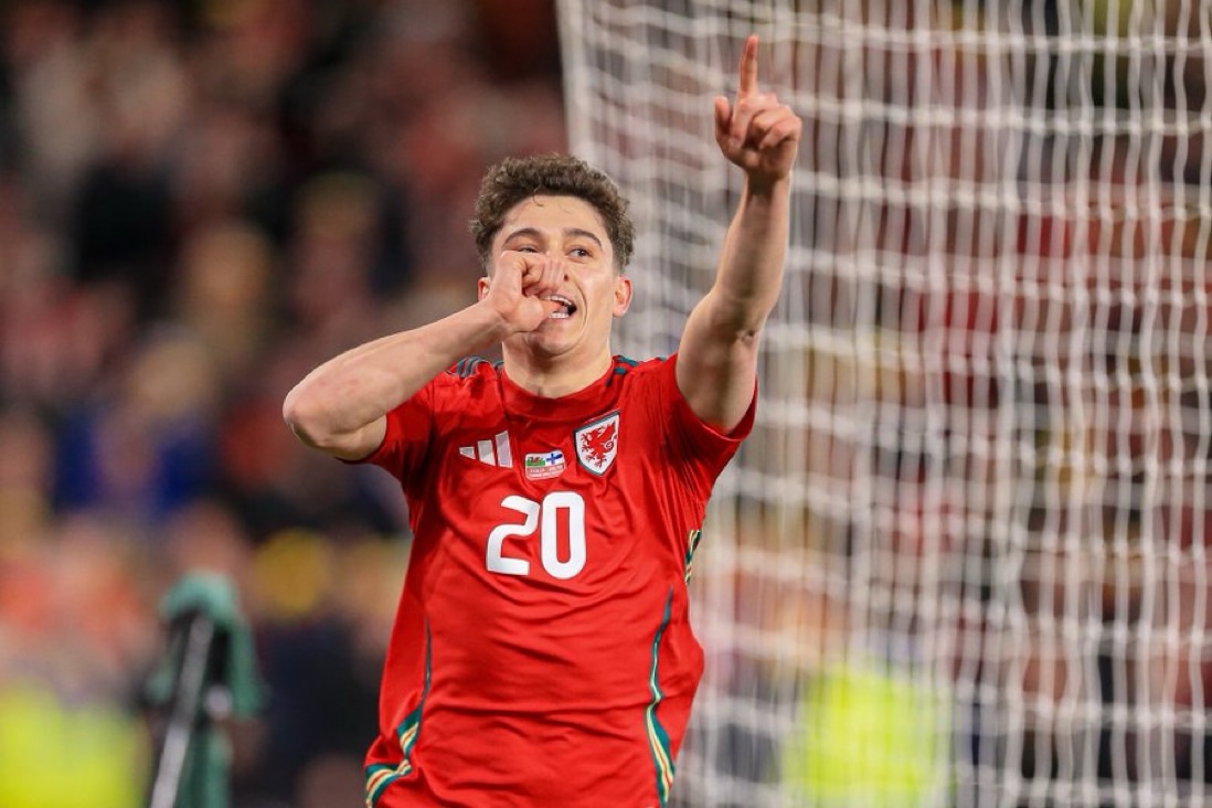 Dan James celebrates scoring Wales fourth against Finland