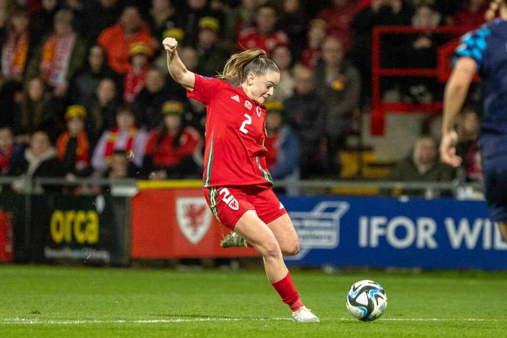 Lily Woodham takes a shot at goal for Wales against Croatia