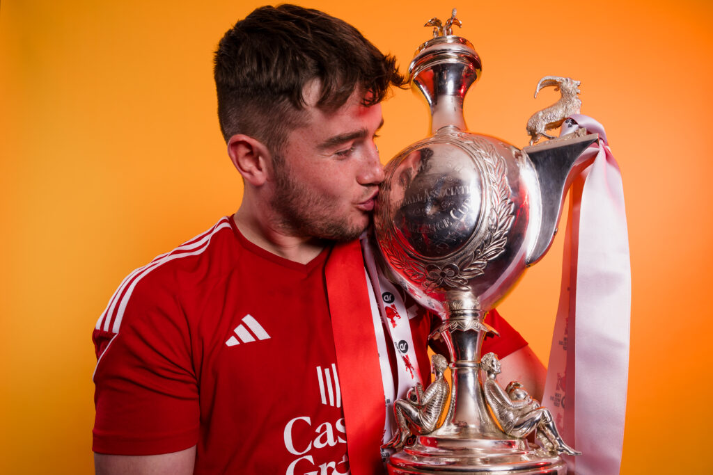 Connah's Quay player Josh Williams kisses the Welsh Cup