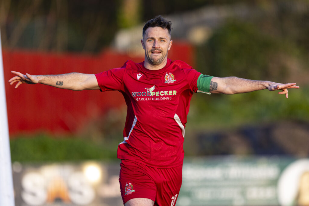 Luke Bowen celebrates after scoring his first goal for Briton Ferry against Ammanford