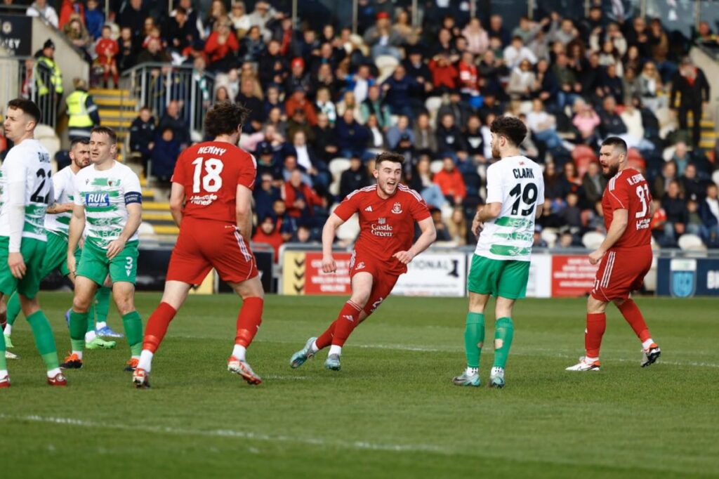 Josh Williams celebrates scoring for Connah's Quay against TNS in the Welsh Cup final