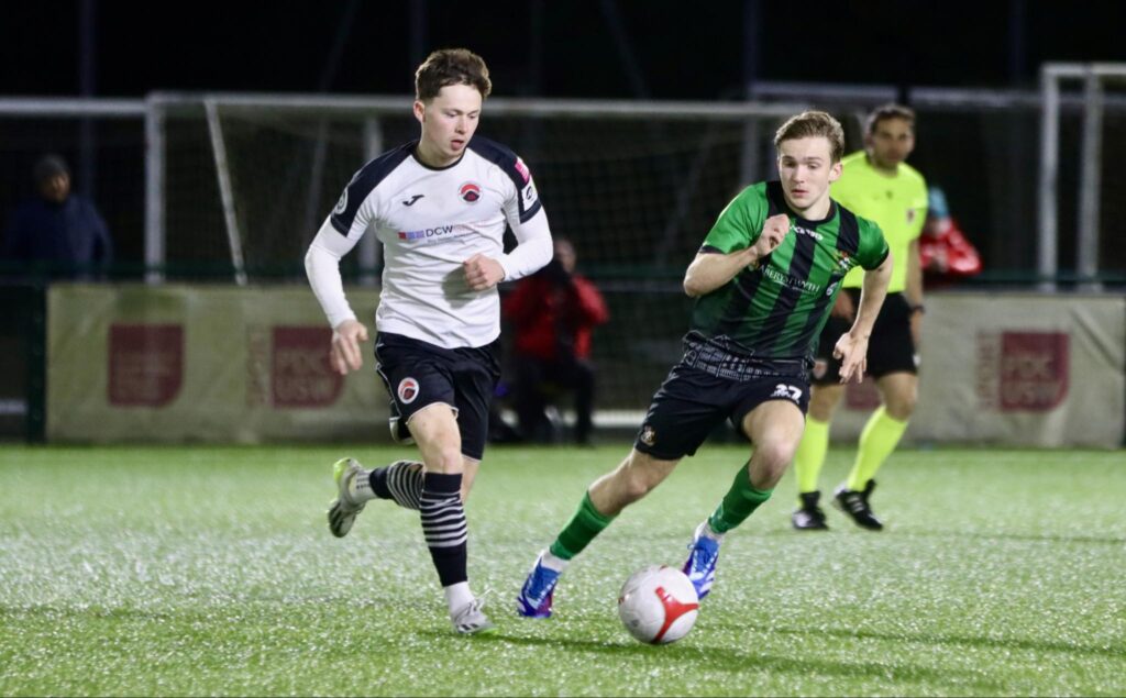 Pontypridd United midfielder Ryan Bevan dribbling with the ball.