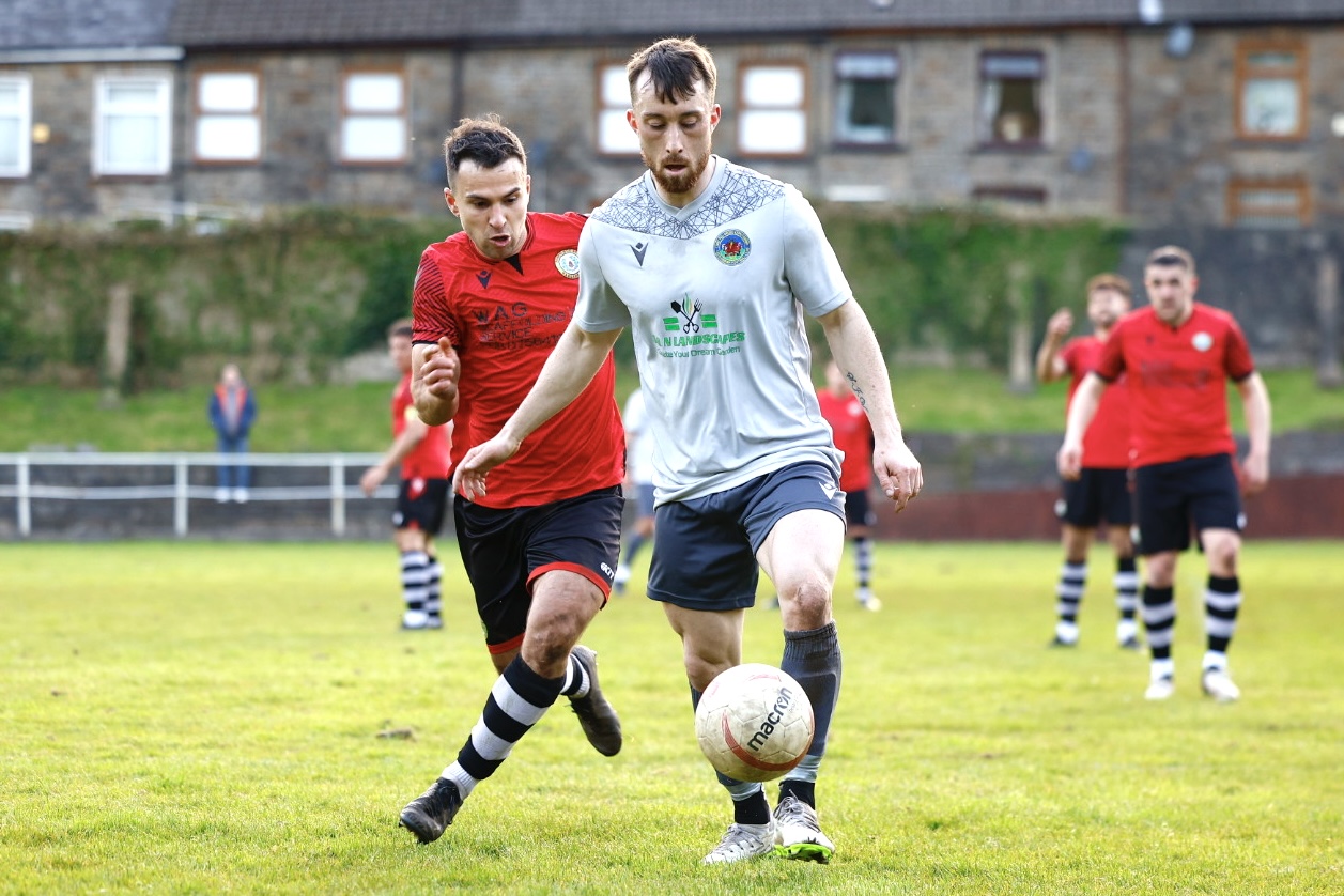 A Cefn Cribwr player in possession against Penrhiwceiber Rangers.