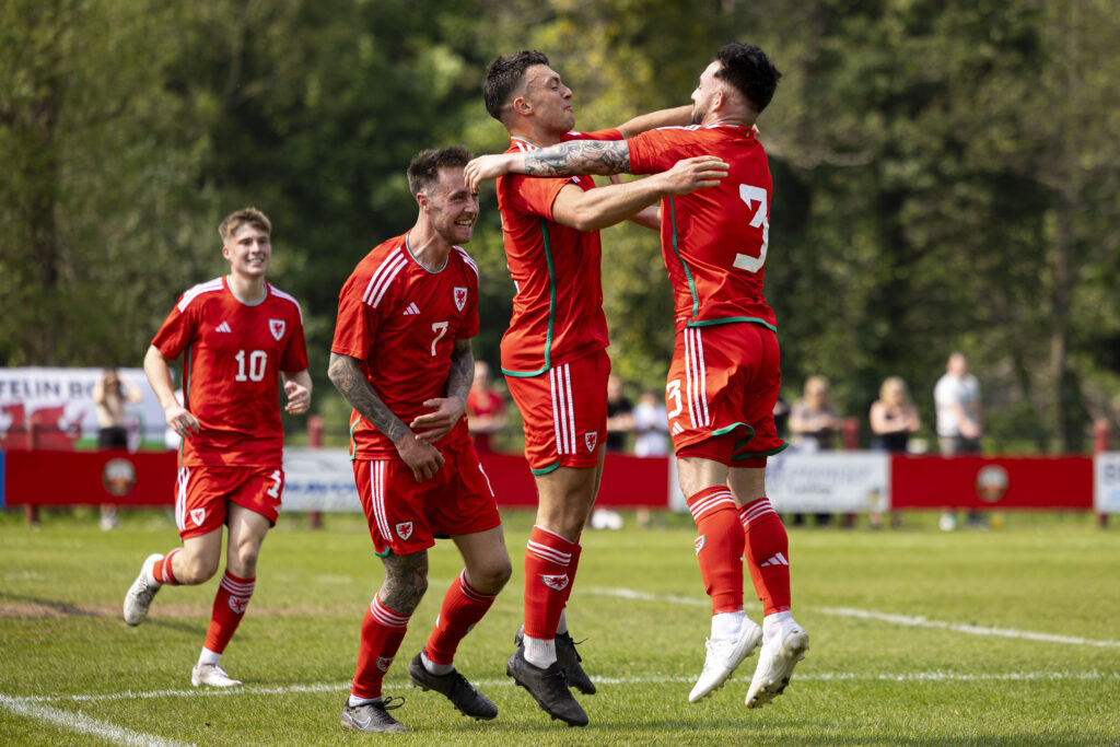 Liam Eason celebrates with Cam Strinati after scoring for Cymru South against the Cymru North in the UEFA Regions Cup qualifier