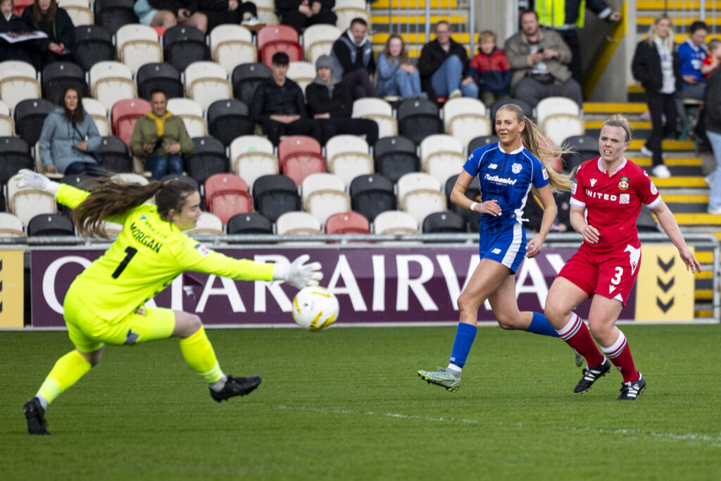 Cardiff City Womens' Rhianne Oakley scores her sides first goal during the 2023/24 Bute Energy Welsh Cup Final fixture between Wrexham AFC Women and Cardiff City
