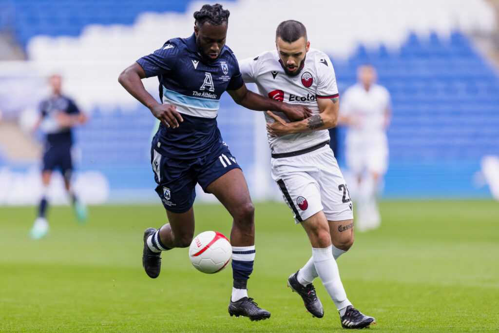 CARDIFF, WALES - 20 JULY 2023: Haverfordwest County's Martell Taylor-Crossdale and Shkëndija's Kamer Qaka during the UEFA Europa Conference League qualifier second leg fixture between Cymru premier’s Haverfordwest County & KF Shkëndija of North Macedonia at the Cardiff City Stadium, Cardiff, Wales.  (Pic by John Smith/FAW)