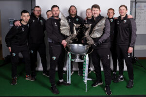 OSWESTRY, ENGLAND - 02 MARCH 2024: TNS Staff poses with the trophy after winning the league during phase 2 of the JD Cymru Premier 2023/24 Championship Conference league fixture between The New Saints FC & Cardiff Metropolitan University F.C at Park Hall, Oswestry, Wales. (Pic By John Smith/FAW)