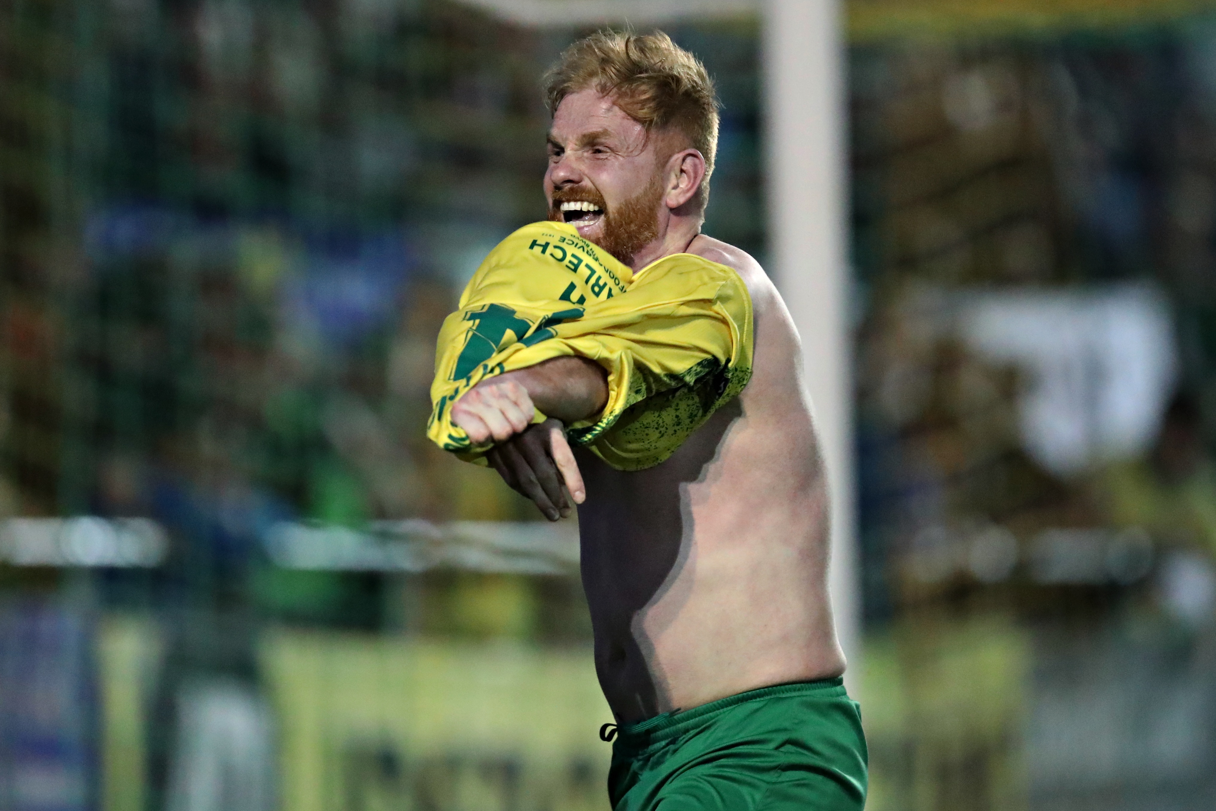 Marc Williams celebrates scoring a goal for Caernarfon Town in Welsh football's Cymru Premier play-off semi final.