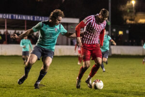 HOLYWELL, WALES - 27TH FEBRUARY 2024: Holywell Town's Jamie Breese makes it 3-0 to the home side just before half time at the JD Cymru North fixture between Holywell Town and Guilsfield at the Achieve More Stadium, Holywell. 27th of February, Holywell, Wales