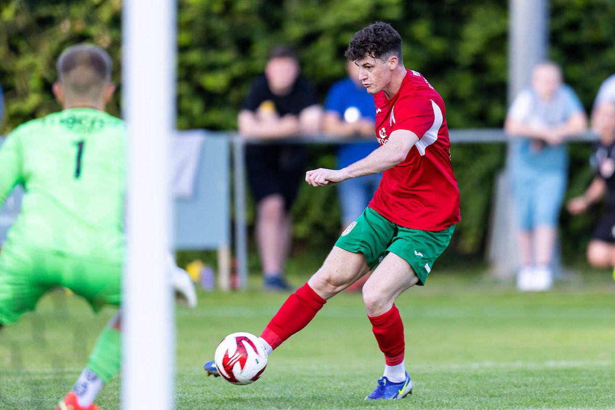 TAFFS WELL, WALES - 19th July 2024: Tom Handley of Merthyr Town scores his sides first goal. Taffs Well v Merthyr Town in the Nathaniel MG Cup at Rhiw Dda'r on the 19th July 2024. (Pic by Lewis Mitchell/FAW)