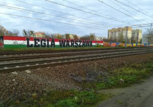 Paint work of Legia Warsaw near a train line