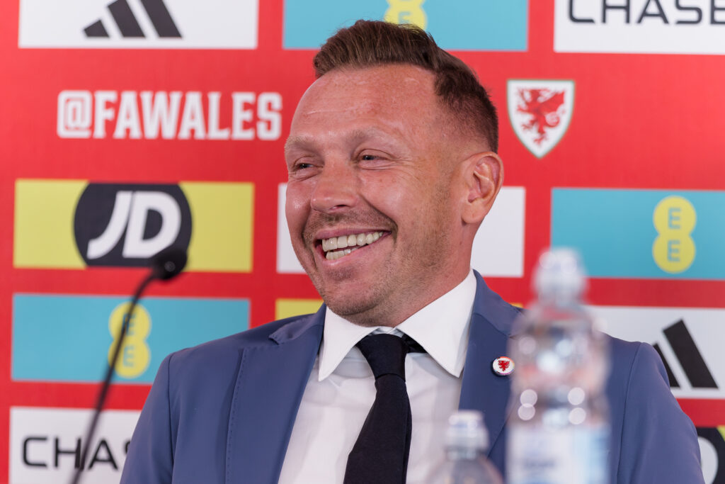 Craig Bellamy smiles as he is unveiled as Wales manager at a press conference