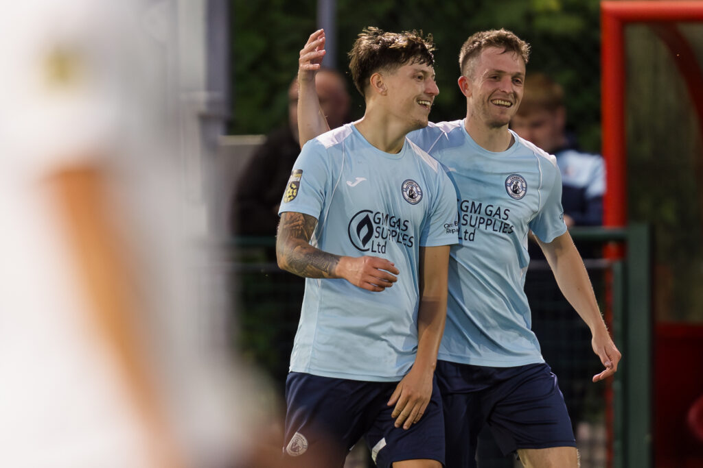 Thomas Hillman scores to make it 1-2 and celebrates during the 2024/25 JD Cymru South fixture between Pontypridd United F.C & Cambrian United F.C at USW Sports Park, Treforest